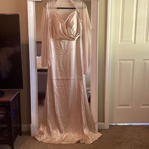 Long formal dress in gold satin. Has lace up back and shawl.